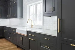 Light gray kitchen with dark countertop photo