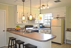 Lamps in a small kitchen interior photo