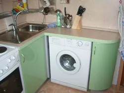 Kitchen design in Khrushchev with a gas water heater and a washing refrigerator