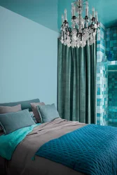 Turquoise curtains in the bedroom interior photo