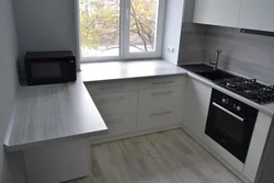 Kitchen by the window in a Khrushchev apartment photo