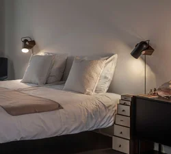 Modern wall lamps for the bedroom above the bed photo