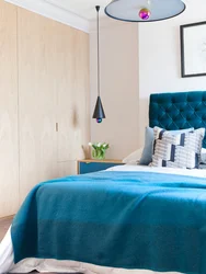 Turquoise Bed In A Bedroom Interior With Soft