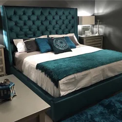 Turquoise Bed In A Bedroom Interior With Soft