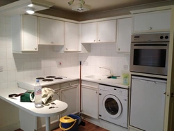 Corner Kitchen With Refrigerator And Washing Machine Photo