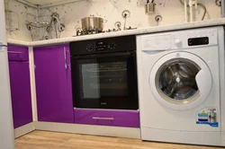 Corner kitchen with refrigerator and washing machine photo