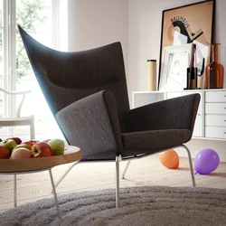 Кресло в интерьере гостиной в современном стиле