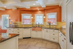 Peach-colored kitchen in the interior photo