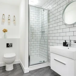 White bathrooms with showers photo