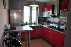 Red interior of a small kitchen