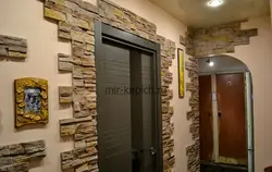 Hallway with decorative stone and wallpaper photo