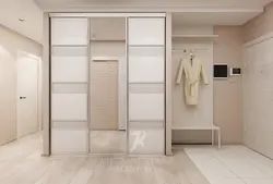 Photo of the interior of the hallway with a wardrobe in light colors