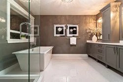 Bathroom design with dark floors and light walls