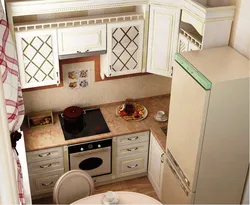 Interior Of A Small Corner Kitchen With A Refrigerator