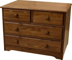 Chest of drawers in the bedroom made of wood photo