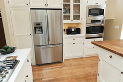 Silver Refrigerator In The Kitchen Interior