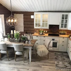 White kitchen in a wooden house in the interior