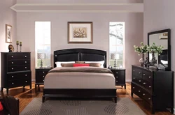 Dark furniture in a light bedroom interior