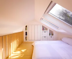 Attic design with a gable roof bedroom photo