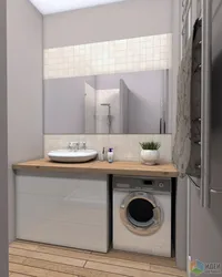 Washing machine under the sink in the bathroom design