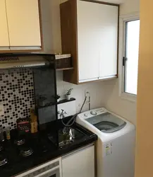 Kitchen with vertical washing machine photo
