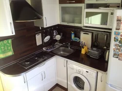 Small kitchen design with refrigerator, washing machine