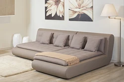 Modern sofa in the living room with a sleeping place photo