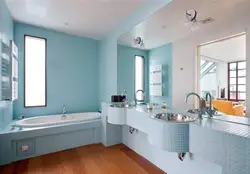 The floor and walls in the bathroom are the same color photo