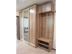 Hallway wardrobe with seat and mirror photo