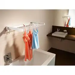 Clothes hangers in the bathroom photo
