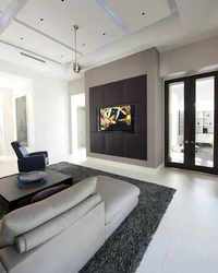 Living room with TV on the wall design photo in the interior