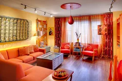 Orange sofa in the interior of the living room photo