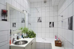 White bathtub with black grout photo