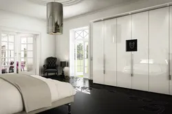 Glossy wardrobes in the bedroom photo