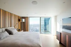 Bedroom design with panoramic windows in an apartment