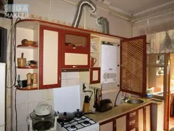 Kitchen design with gas boiler on the floor