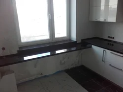 Kitchens with a window if the window is below the countertop photo