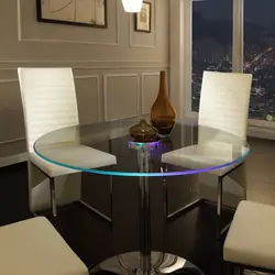 Photo of a round table for the kitchen against the wall