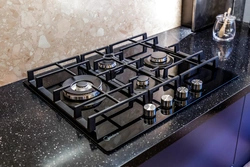 Black gas stove in the kitchen interior