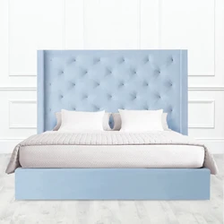 Turquoise Bed In A Bedroom Interior With A Soft Headboard