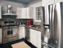 Kitchen design with gray refrigerator photo