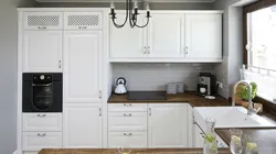 White kitchen black appliances photo wooden countertop