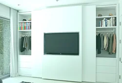 Wardrobe design in the living room with TV