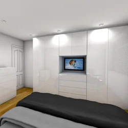 Full-wall bedroom wardrobe design with TV