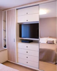 Modern wardrobes with TV in the bedroom photo