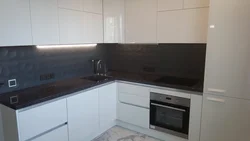 Kitchen design with a dark apron and dark countertop photo