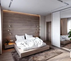 Современный интерьер спальни с ламинатом на стене