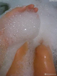 Photo Of Feet In A Bathtub Covered In Foam