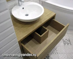 Bath cabinet with countertop sink photo