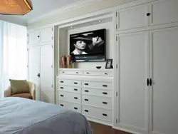 Photo of bedroom cabinets with TV photo